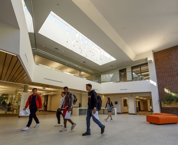 Students walking in the library