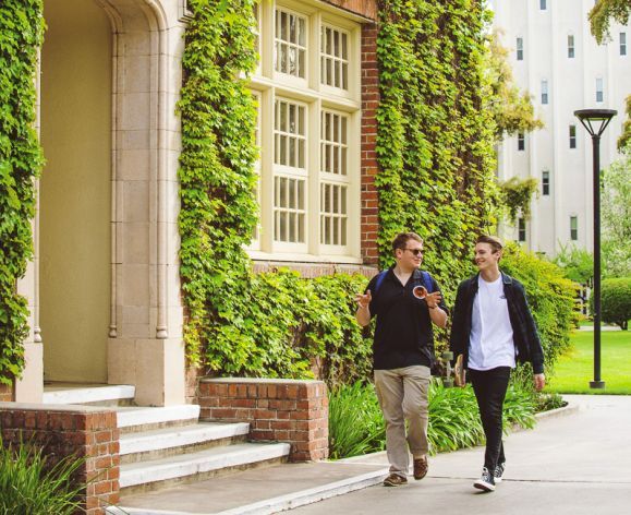 students walking by Knoles Hall