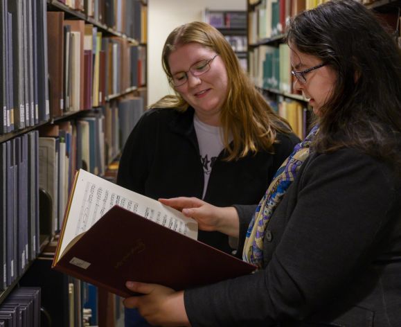 Music History student and professor in the library archives