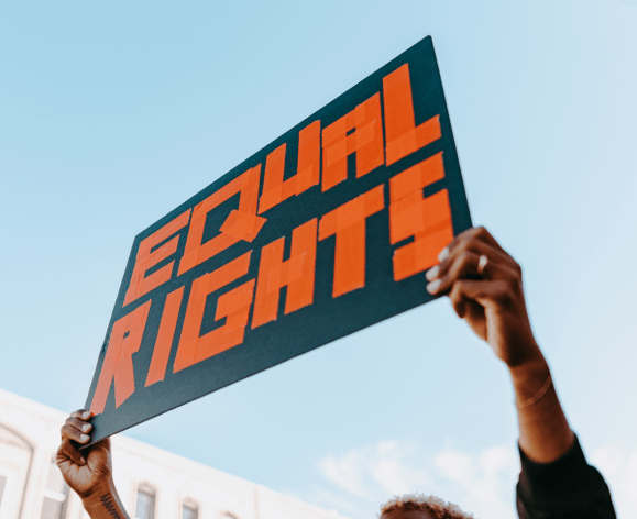 a protester holding up a "Equal Rights" sign