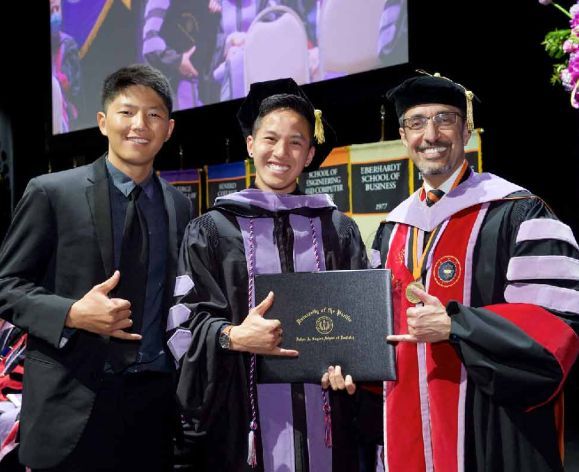 Dean and students at Commencement