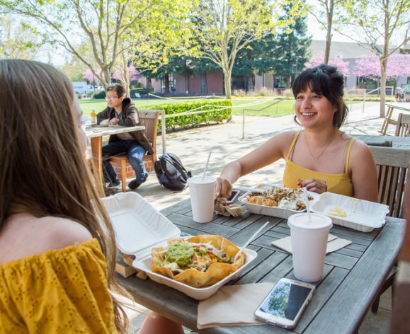 students enjoy lunch outside DeRosa University Center