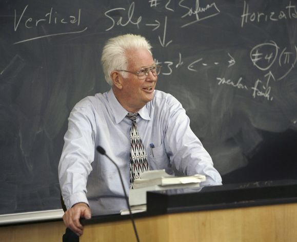 Claude Rohwer behind a lectern