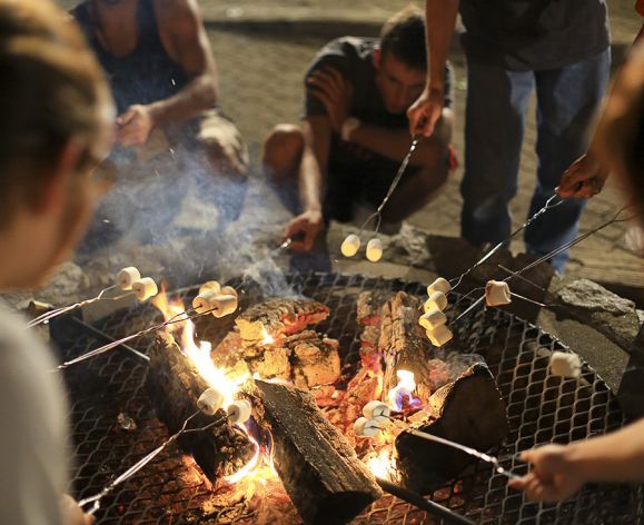 students around a campfire