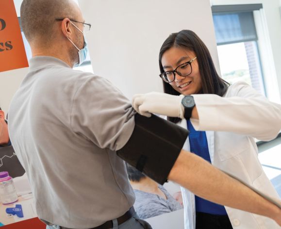 Student in the Doctor of Pharmacy (PharmD) program works with community members in a clinic on University of the Pacific's Stockton campus.