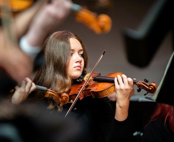 student playing violin