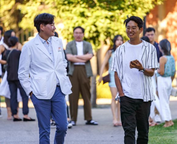 Two students walking on campus