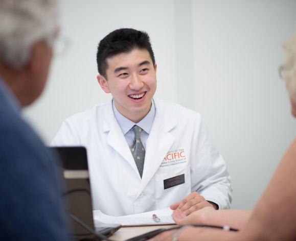 Health Science student working with clients in a community clinic
