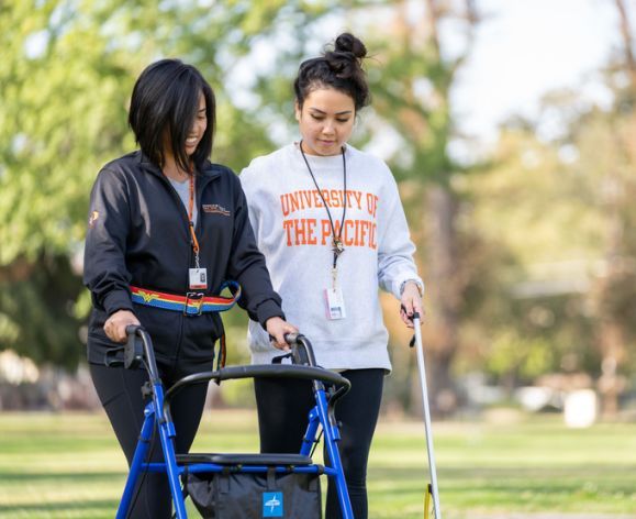 Occupational Therapy students practice OT techniques outdoors
