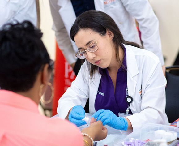 Pharmacy student attending to a patient