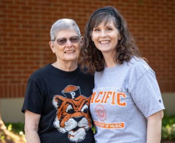 two ladies smiling
