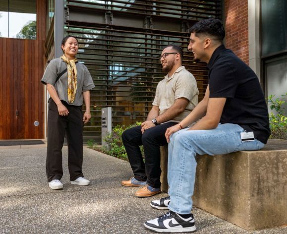 Occupational Therapy students converse in front of the library on Pacific's Sacramento campus.
