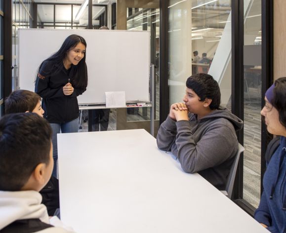 Pacific student leading group discussion