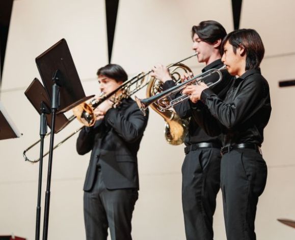 Students in a small horn ensemble