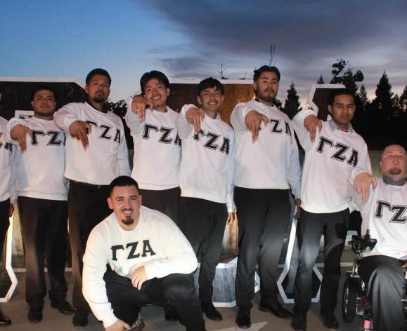 men in a group wear white shirts 