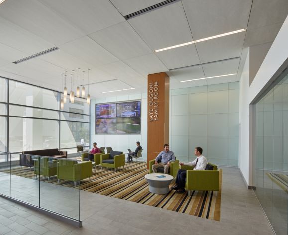 people talk and study in a lounge at Dugoni