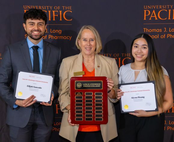 Dean Gundersen with students at the Pharmacy Scholarship Luncheon