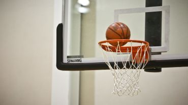 A basketball about to go in the net