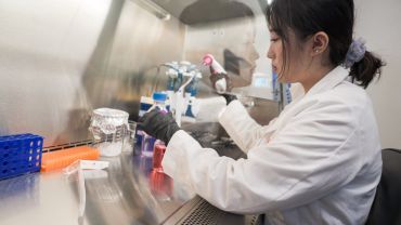 a student running an experiment during the Curing Cancer program