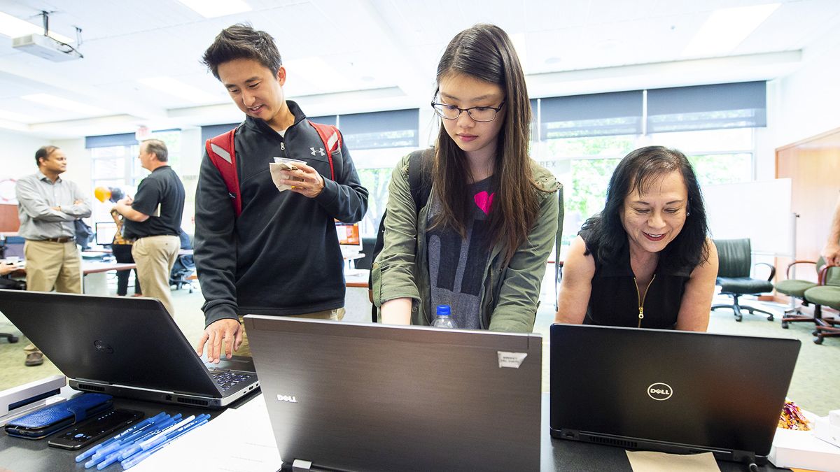 University of the Pacific students and a staff member use computers