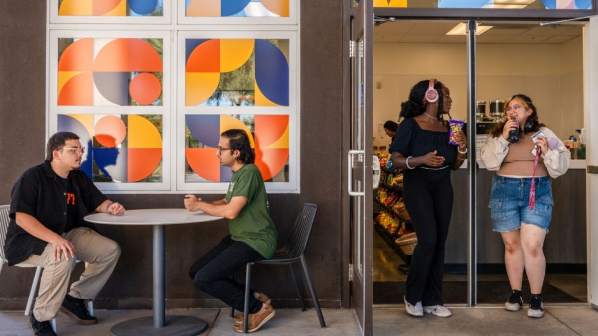 students walk out of the new Cafe 1851