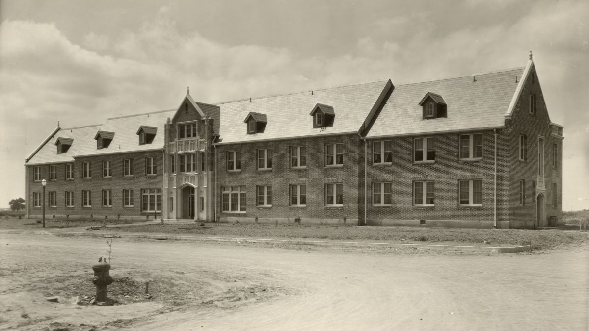 South Hall stands alone in an open field. 