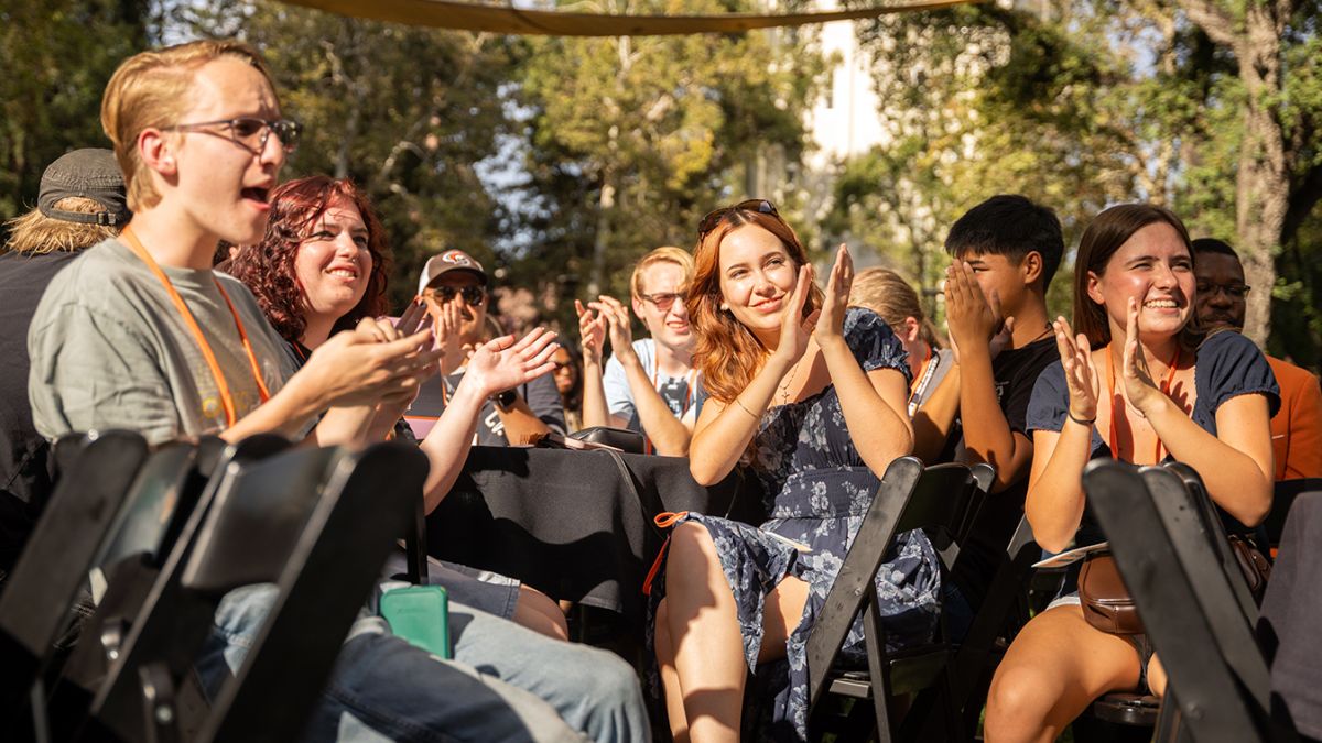 New music majors cheer at a student welcome event.